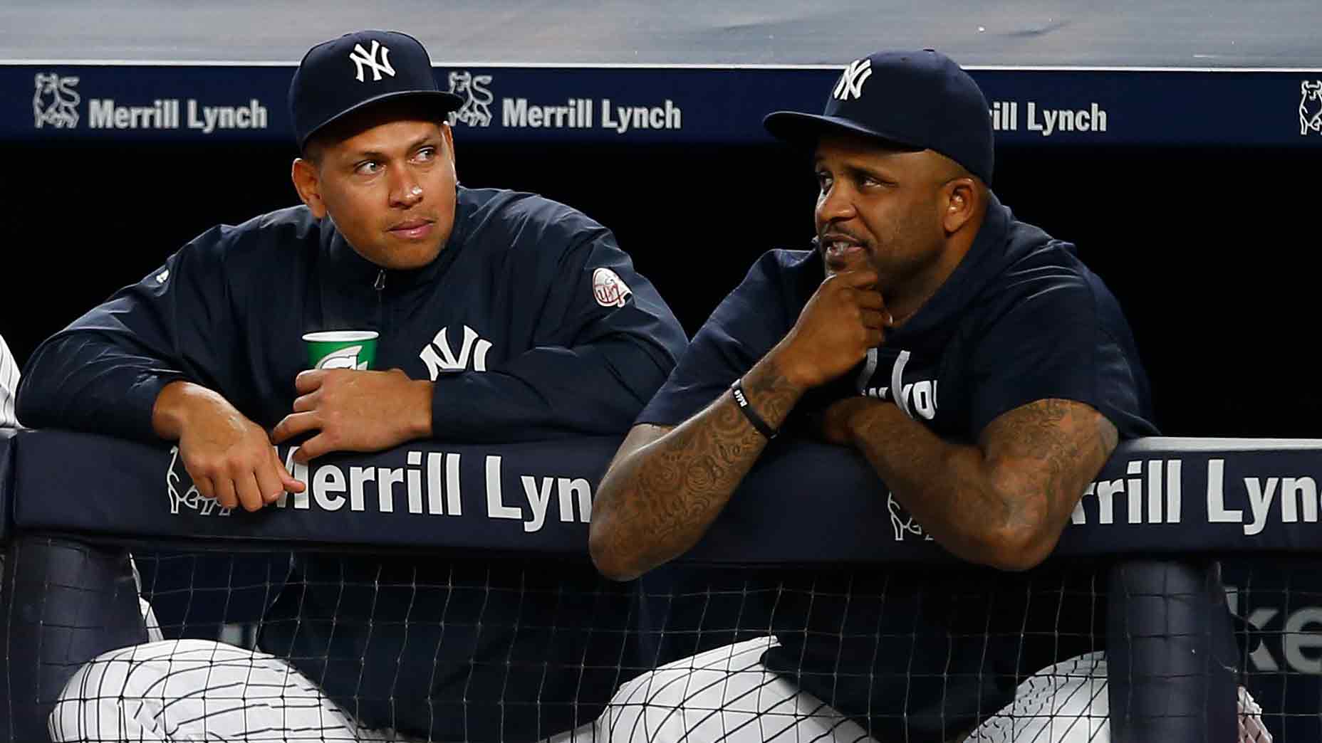 Alex Rodriguez #13 and CC Sabathia #52 of the New York Yankees watch the action from the dugout against the New York Mets a game at Yankee Stadium on August 4, 2016 in the Bronx borough of New York City.