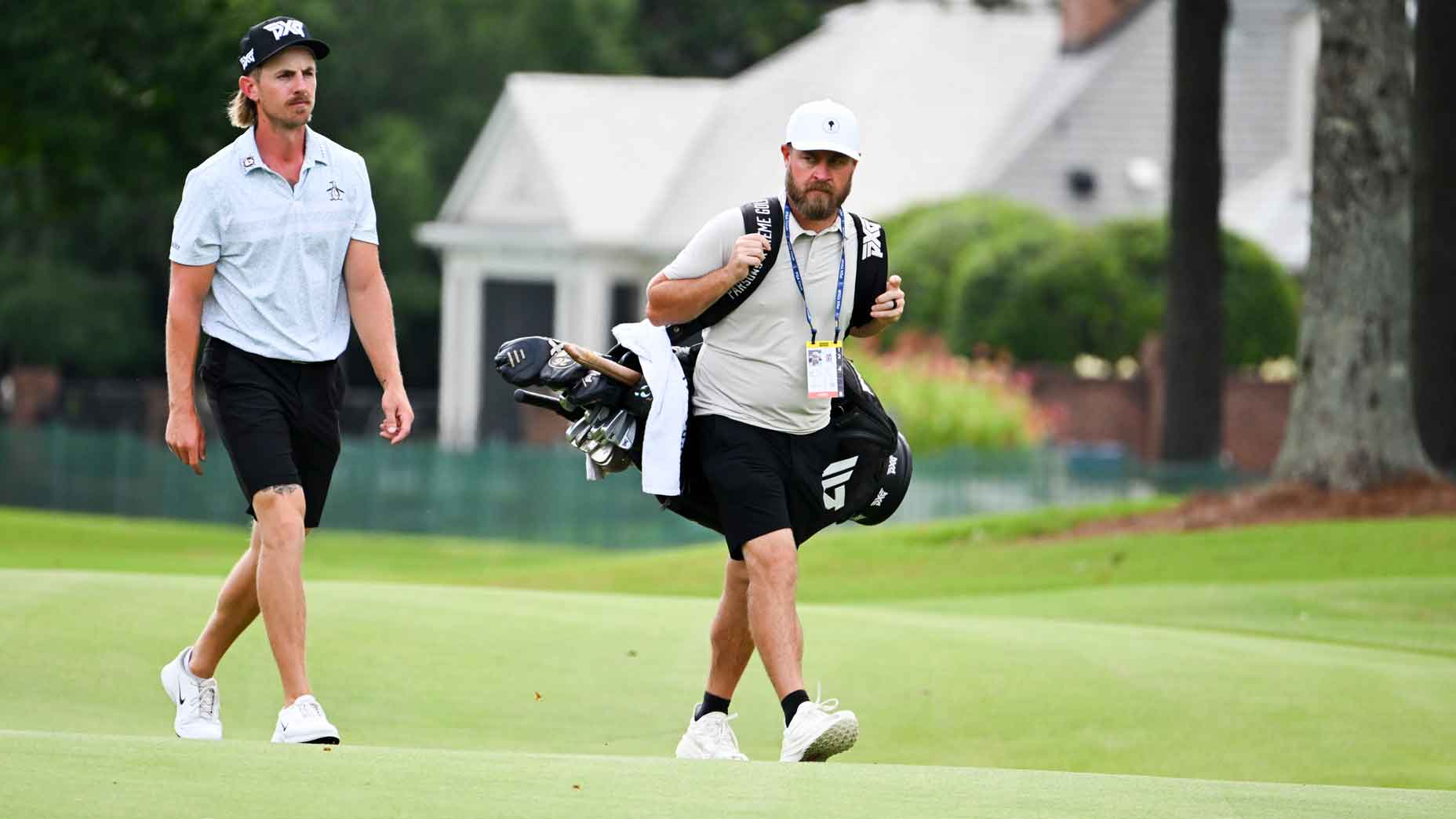 jake knapp and joe greiner walk down the fairway at the 2025 fedex st jude championship
