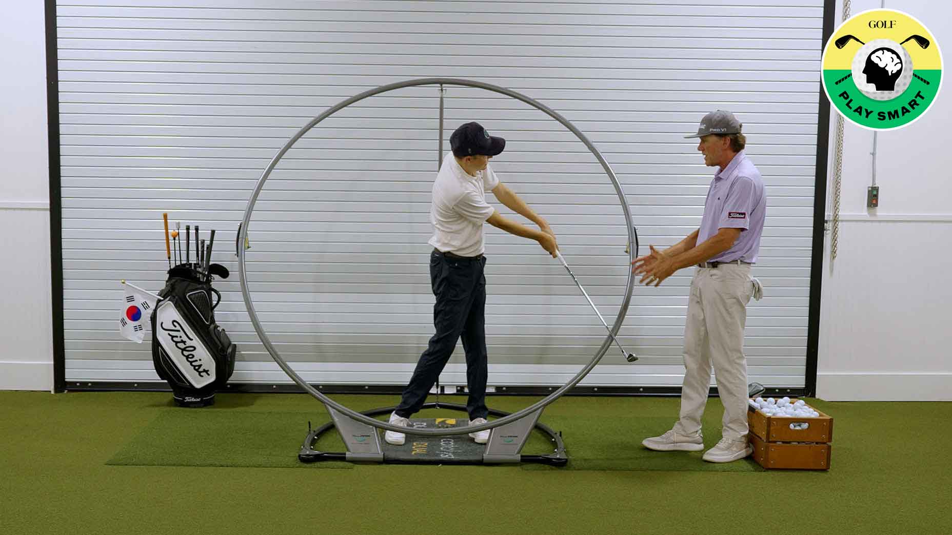 golf teacher instructs student with training aid